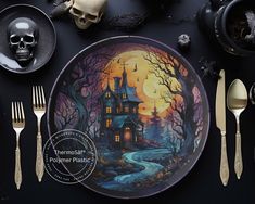 there is a plate with a house on it next to silverware and skeleton skulls