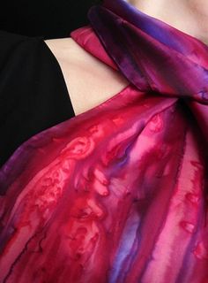 This silk scarf is hand painted in primary red, berry and a touch of amethyst. Amazing, vibrant colors!The scarf measures approximately 11” x 60” and is 100% habotai silk with hand rolled hems. The French dyes are steam set for permanence and the scarf is hand washable. Each scarf comes gift packaged and includes a tying instruction sheet for different ways to wear.  If you are sending as a gift, I can add a matching tag with your special message; just make a note in message to seller when you c Artistic Purple Silk Scarf, Artistic Purple Silk Scarves, Hand Dyed Purple Silk Scarves, Pink Hand-dyed Scarf, Artistic Hand Painted Red Silk Scarf, Pink Hand Painted Silk Scarves, Habotai Silk, Hand Roll, Rolled Hem