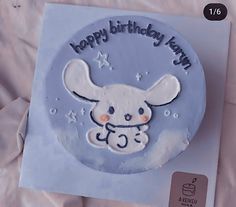 a birthday cake with an image of a bunny on it