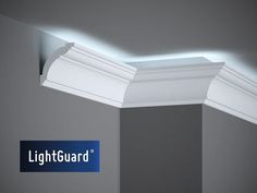 the lightguard logo is lit up on top of an empty room with gray walls and white trim