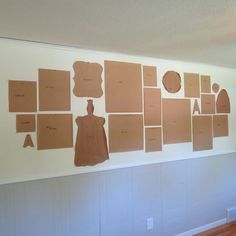 several pieces of cardboard are arranged on the wall