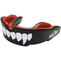 a mouth guard with teeth and fangs on it