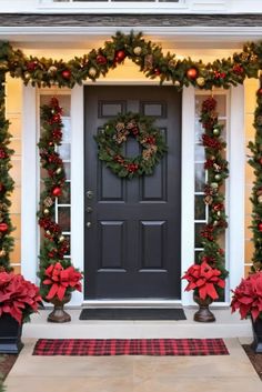 the front door decorated for christmas with poinsettis and greenery