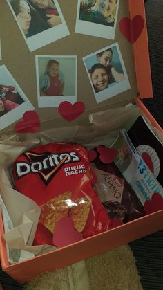 an open box filled with pictures and food