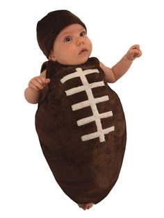 a baby dressed in a football costume