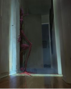 a creepy figure is standing in an empty room with light coming through the door and floor