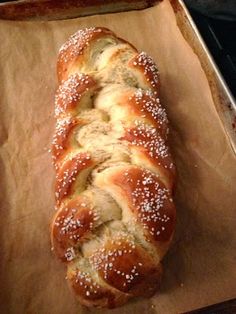 a loaf of bread sitting on top of a piece of wax paper