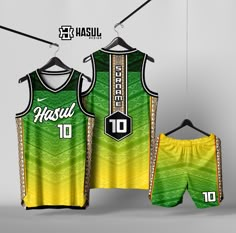 two basketball uniforms hanging on a rack with the number 10 printed on them and shorts underneath