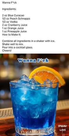 a blue drink with an orange slice in it