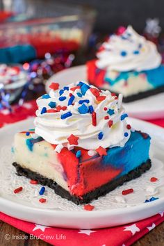 a slice of patriotic cheesecake on a white plate with red, white and blue sprinkles