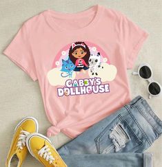 Gabby's Dollhouse Shirt | Gabby and Friends Shirt | Pandy Paws | Catrat | Gabby Rainbow | Dollhouse inspired shirt | Gabby Cats Handmade item * Made to order * Personalizable ➼ All of our tees are high quality, super soft and comfortable. Made with top of the line vinyl and pressed with a professional grade heat press, therefore super durable and very long lasting!  100% Customer Satisfaction and Fast Shipping!          All the t-shirts are made by me in my smoke-free office. ➡️𝗛𝗢𝗪 𝗧𝗢 𝗢𝗥𝗗𝗘𝗥 ⬅️ ✔Make sure you check our size-chart in pictures before you place your order.  Follow HOW TO ORDER instructions in pictures above.         For RUSH ORDER REQUEST follow Link below ⬇️ ⬇️ https://www.etsy.com/listing/1464003427/rush-order-request?click_key=f7bbd3aac766c58f42a548c903c8952f32c1f Rainbow Dollhouse, Pandy Paws, Friends Shirt, Blue Design, Kids Tops, The Line, Heat Press, Customer Satisfaction, To My Daughter