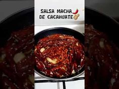 there is a sign on the stove that says salsa macha de cacachate