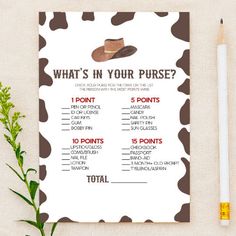 a brown and white cow printable wedding seating chart with a cowboy hat on it