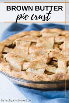 a close up of a pie on a table with the words brown butter apple pie