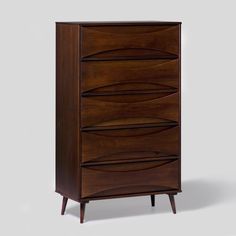 the chest of drawers is made from wood and has five drawers on each side, with three