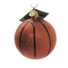 a basketball ornament with a tag on it's top hanging from a hook