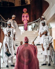 a group of people standing on top of stairs