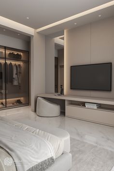 a large white bed sitting in a bedroom next to a tv mounted on a wall