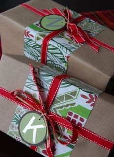 two presents wrapped in brown paper and tied with red ribbon