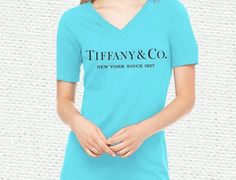 New Tiffany & Co Tahit Blue V-neck T-shirt, Ladies Crewneck or Unisex Crewneck
4 ounce
60% combed ring spun cotton/40% polyester jersey
30/1
Lightweight cotton poly jersey
Set-in 1x1 baby rib collar with front cover-stitch
 Please make sure to check size chart in photos for measurements (Only The ladies fitted tees runs a bit small.) Size up Company Sweatshirt, Engagement Bride, Tiffany And Co, V Neck, Collar, T Shirt, Blue