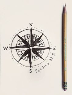 a pen and pencil sitting on top of a piece of paper next to a drawing of a compass