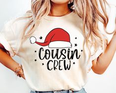 a woman wearing a t - shirt with the words cousin crew printed on it