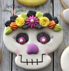 a decorated sugar skull sitting on top of a wooden table