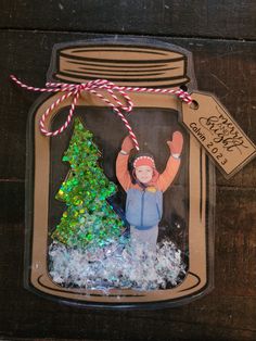 a christmas ornament in a glass jar