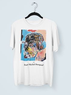 Hi guys, Thank you for stopping by my shop. If you have any questions or need anything please feel free to reach out! Best, Aly :) A Jean-Michel Basquiat print shirt. Basquiat Shirt, Jean Michel Basquiat Print, Pop Art Shirt, Artsy Shirt, Abstract Shirt,Aesthetic Shirt,Graphic Shirts, 90s Shirts PLEASE NOTE that colors might vary due to lighting conditions and monitor/device resolutions. :) Unisex Jersey Short Sleeve Tee- - 100% Airlume combed and ringspun cotton (fiber content may vary for diff Artsy Graphic Tees, Custom Artwork Short Sleeve Shirt For Streetwear, Streetwear Short Sleeve Shirt With Custom Artwork, Pop Culture Funny Print Shirt For Streetwear, Multicolor Funny Print Shirt For Streetwear, Artistic T-shirt With Funny Print For Streetwear, Artistic Funny Print T-shirt For Streetwear, Retro Shirt With Custom Print For Streetwear, Retro Custom Print Shirt For Streetwear