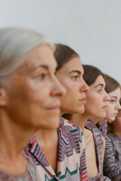 a row of women sitting next to each other