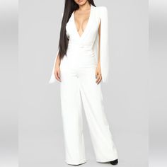 Fashion Nova Woman Of Many Talents Jumpsuit Color: Ivory Size: Xs Nwt Cape Sleeve Jumpsuit Wide Leg Deep V Neck Zipper Front Single Button Closure Lined Moderate Stretch 34 Inseam Self: 100% Polyester Lining: 100% Polyester Fitted White V-neck Jumpsuits And Rompers, White Long Sleeve Pantsuit For Party, Elegant White Long Sleeve Jumpsuit, White Long Sleeve Jumpsuits And Rompers For Evening, White Long Sleeve Jumpsuits For Evening, Elegant White V-neck Jumpsuit, White Long Sleeve Jumpsuits For Night Out, White Long Sleeve Evening Pantsuit, White V-neck Pantsuit For Party