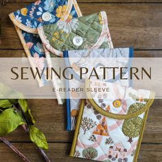 sewing pattern e - reader sleeve for baby bibs and burps, on a wooden surface