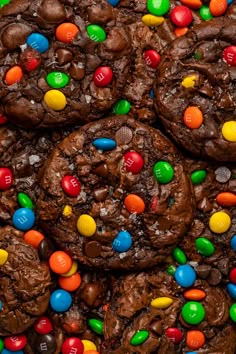 chocolate cookies with m & m and m's on top, surrounded by candy