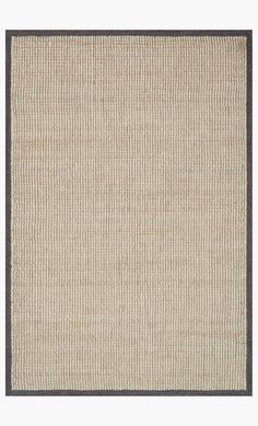 a beige rug with black border