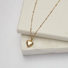 Our Small Heart Locket can be worn empty or you can add a photo of your choice to the center. Feel loved everywhere you go. Add your fur baby, your significant other, your kids, and even your favorite celebrity -- we think Dolly would be perfect! We also offer a Large Heart Locket as well! 18K Gold Plated Stainless Steel 13mm Heart Pendant Dotted 16.25" Chain with 2.5" Extender Jewelry Care: It is important to gently clean your jewelry with a soft cloth after each use. We recommend removing your Large Heart, Feel Loved, Heart Locket, Small Heart, Feeling Loved, Significant Other, Jewelry Party, Wholesale Jewelry, Ring Necklace