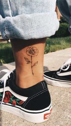 a small rose tattoo on the ankle