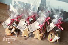 some cookies are wrapped in cellophane and tied with red ribbon to give them as gifts