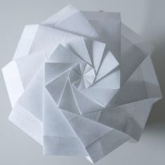 an origami sculpture made out of white paper