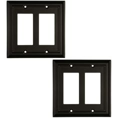 two black wall plates with one light switch