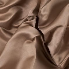 Create your own red carpet look with this Double Faced Duchesse Satin. Luminous with an incredibly smooth hand, this duchesse satin showcases pure luxury. Thicker with a medium weight, it has a full drape that is perfect for A-line gowns. Its stiffness creates a durability perfect for beading and sequins. Opaque, a lining is optional depending on its application. This collection features six color ways, so you are sure to find the perfect color for you! Solid Color Silk Satin Dress, Formal Solid Color Satin Dress, Classic Satin Dress For Party, Formal Silk Satin Dress, Classic Silk Satin Formal Dress, Classic Silk Satin Dress For Formal Occasions, Red Carpet Look, Mood Fabrics, A Line Gown