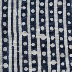 a black and white striped fabric with dots on it