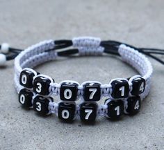 a black and white bracelet with numbers on it