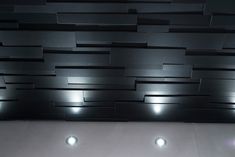 Modern textured black tile wall detail & custom lighting design at LA loft home. Wall Detail, Modern Tiles