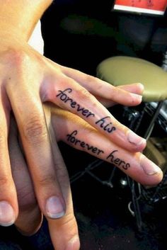 two people with tattoos on their hands and one has the words forever all i have