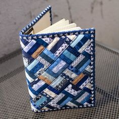 a blue and white quilted book holder