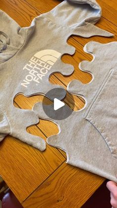 someone is making a puzzle piece t - shirt with the words keep peace on it