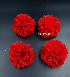 four red flowers on a black surface with the words bridal crafts written below them