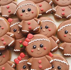 many decorated cookies are arranged on a table