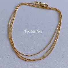 "DESCRIPTION: Thank you for coming in! Genuine 14K SOLID YELLOW GOLD necklace with wheat chain links and lobster clasp. THEY ARE STAMPED WITH \"14KT Italy\", but we could not show it clearly in the pictures. Adjustable up to 22\" length! Quite hefty and strong! You'll get 1 necklace per winning! DIMENSION: 0.91mm wheat chain, 4mmx8.5mm lobster clasp. WEIGHT: Appr. 3.1 gram MATERIAL: 14K Yellow Gold" 14k Yellow Gold Snake Chain Bracelet, Dainty Yellow Gold Snake Chain Bracelet, Yellow Gold 14k Snake Chain Bracelet, Yellow Gold Bracelets With Wheat Chain As A Gift, Yellow Gold Double Strand Cable Chain Jewelry, Dainty Yellow Gold Chain Necklace With Lobster Clasp, Classic Gold Chain Bracelet With Wheat Chain, Gold Wheat Chain Bracelet Gift, Gold Wheat Chain Bracelet As Gift