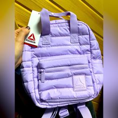 Brand New With Tags. Small Sized Reebok Back Pack In Purple. Purple Nylon Sporty Backpack, Functional Purple Nylon Backpack, Purple Nylon Backpack, Rectangular Purple Nylon Backpack, Purple Backpack With Zipper Closure For On-the-go, Womens Reebok, Color Purple, New Color, Bag Lady